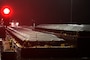 Tow boat enters Lock and Dam 2 on the Mississippi River at night.