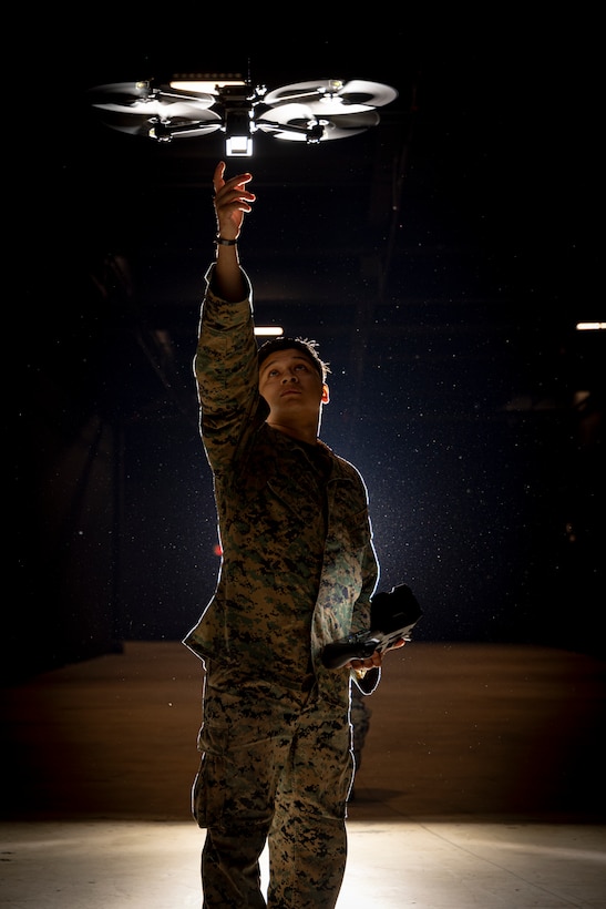 U.S. Marine Corps Lance Cpl. Giancarlos Maldonado, a native of Pennsylvania, and a drone operator with Headquarters Company, 6th Marine Regiment, 2nd Marine Division, poses for a portrait with a Skydio X2D on Marine Corps Base Camp Lejeune, North Carolina, Nov. 21, 2025. Drone operators showcased Small Unmanned Aircraft Systems capabilities to 6th Regiment leadership and staff to provide an understanding for first person view operations and tactics.