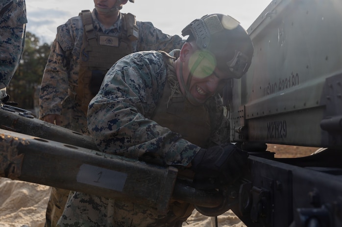 U.S. Marine Corps Lance Cpl. Yadiel Alonsogarcia, a motor transport operator with Headquarters and Service Battalion, 2nd Marine Logistics Group, sets up a toe-bar during fording and recovery training at Marine Corps Base Camp Johnson, North Carolina, Nov. 19, 2025. Marines with H&S Bn. conducted fording and recovery training with HUMVEES in preparation for an upcoming field exercise as well as to improve overall capabilities and mission readiness. Alonsogarcia is a native of Flordia. (U.S. Marine Corps photo by Lance Cpl. Franco Lewis)