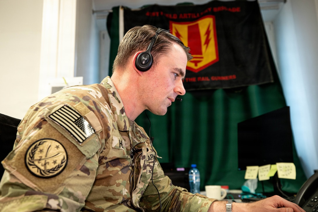 U.S. Army Capt. Brandon Hebert, an Aerial Fires Support Officer, attends a synchronization meeting between supporting elements of the 41st Field Artillery Brigade and V Corps headquarters during Avenger Triad 25, Oct. 30, 2025, Camp Kosciuszko, Poland.