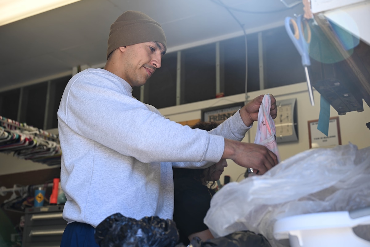 A man organizes clothes