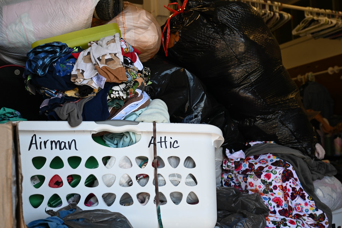 Pile of donated goods stacked into bags and bins