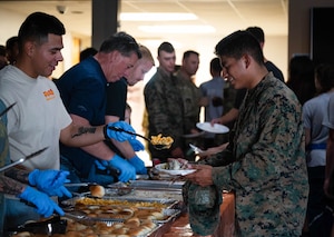 Community volunteers serve Thanksgiving dinner to students at the Crossroads Student Ministry Center at Goodfellow Air Force Base, Texas, Nov. 21, 2025. With the help of community volunteers and Goodfellow leadership, hundreds of military students from all branches of service received a Thanksgiving meal. (U.S. Air Force photo by Airman 1st Class Maria Mota)