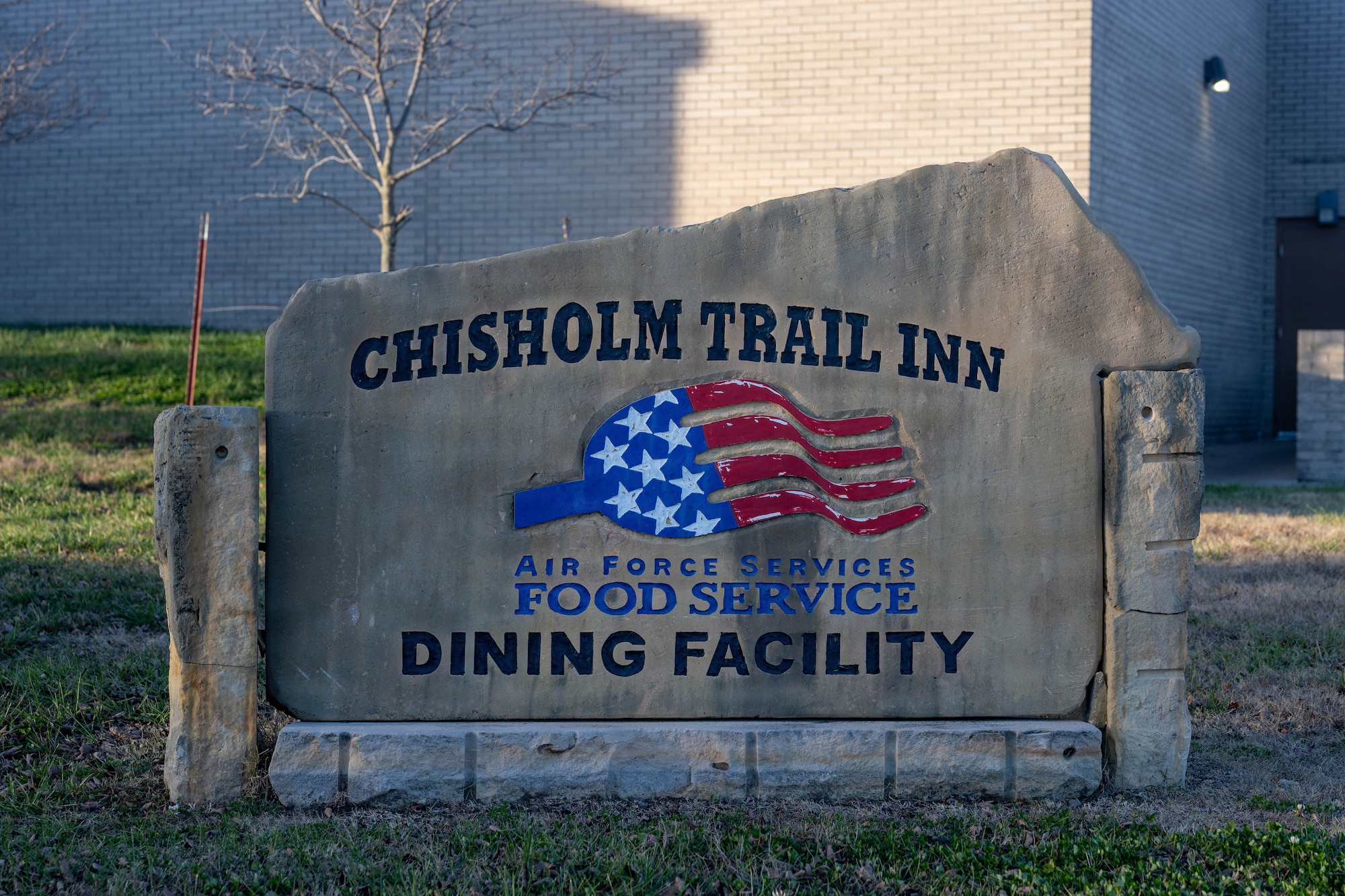 A sign represents the Chisholm Trail Dining Facility at McConnell Air Force Base, Kansas, Nov. 26, 2025. The DFAC will be renovated in December in order to improve faulty equipment and reduce wait times for customers. (U.S. Air Force photo by Airman 1st Class Patrick O’Neill)