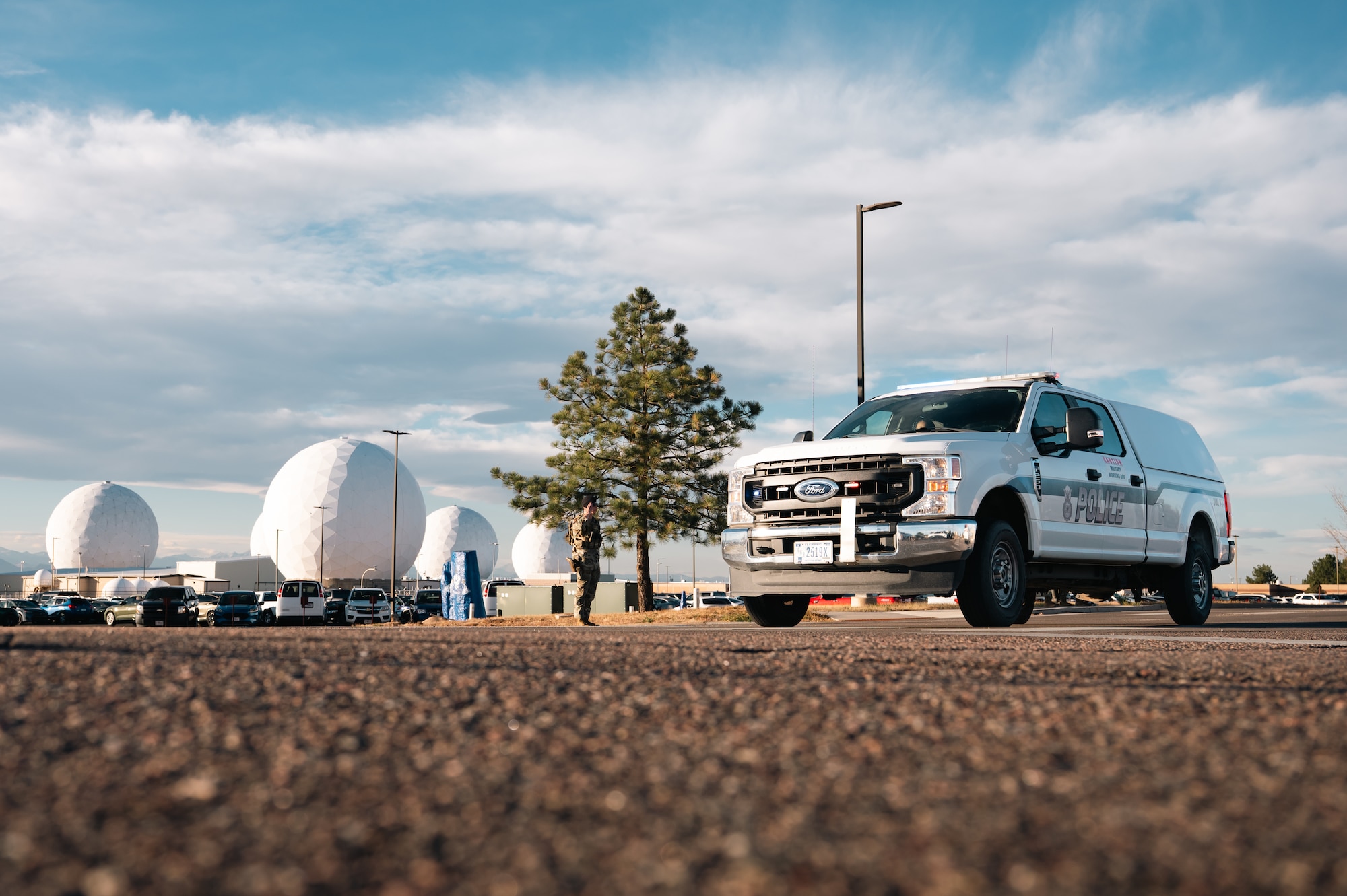 security forces car driving with lights on