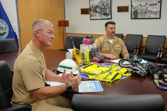 The Navy Closure Task Force-Red Hill (NCTF-RH) safety officer, left, explains safety protocols used during closure operations at the Red Hill Bulk Fuel Storage Facility (RHBFSF) to online guests during the webinar on personnel safety on Joint Base Pearl Harbor-Hickam, Hawaii, Sept. 24, 2025. Charged with the safe decommissioning of the RHBFSF, NCTF-RH was established by the Department of the Navy as a commitment to the community and the environment. NCTF-RH continues to engage with the people of Hawaii, regulatory agencies, and other stakeholders as it safely and deliberately decommissions the facility. (U.S. Navy photo by Mass Communication Specialist 3rd Class Krystal Diaz)