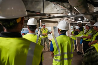 Cmdr. Benjamin Dunn, deputy for environment and remediation, Navy Closure Task Force-Red Hill (NCTF-RH), speaks to the Commission on Water Resource Management commissioners and Hawaii Department of Land and Natural Resources staffers during a site visit to the Red Hill Bulk Fuel Storage Facility (RHBFSF) in Honolulu, Sept. 30, 2025. Charged with the safe decommissioning of the RHBFSF, NCTF-RH was established by the Department of the Navy as a commitment to the community and the environment. NCTF-RH continues to engage with the people of Hawaii, regulatory agencies, and other stakeholders as it safely and deliberately decommissions the facility. (U.S. Navy photo by Mass Communication Specialist 1st Class Glenn Slaughter)