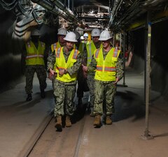 Chief of Naval Operations Adm. Daryl Caudle speaks with Capt. Robert Kleinman, Navy Closure Task Force-Red Hill (NCTF-RH) facilities director, about the status of degassing and closure operations during a site visit to the Red Hill Bulk Fuel Storage Facility (RHBFSF) in Honolulu, Nov. 21, 2025. NCTF-RH was established by the Department of the Navy to safely decommission the RHBFSF and emphasize the Navy's commitment to the community and the environment. NCTF-RH continues to engage with the people of Hawaii, regulatory agencies, and other stakeholders as it safely and deliberately decommissions the RHBFSF. (U.S. Navy photo by Mass Communication Specialist 1st Class Glenn Slaughter)
