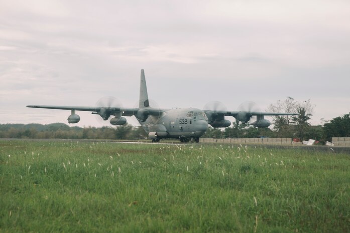 A U.S. Marine Corps KC-130J Super Hercules assigned to Marine Aerial Refueler Squadron (VMGR) 152, Marine Aircraft Group 12, 1st Marine Aircraft Wing, arrives to deliver hundreds of family food packs and personnel with the 15th Marine Expeditionary Unit, I Marine Expeditionary Force, and 3d Marine Expeditionary Brigade, III MEF, in support of foreign disaster relief operations at Virac, Philippines, Nov. 15, 2025.