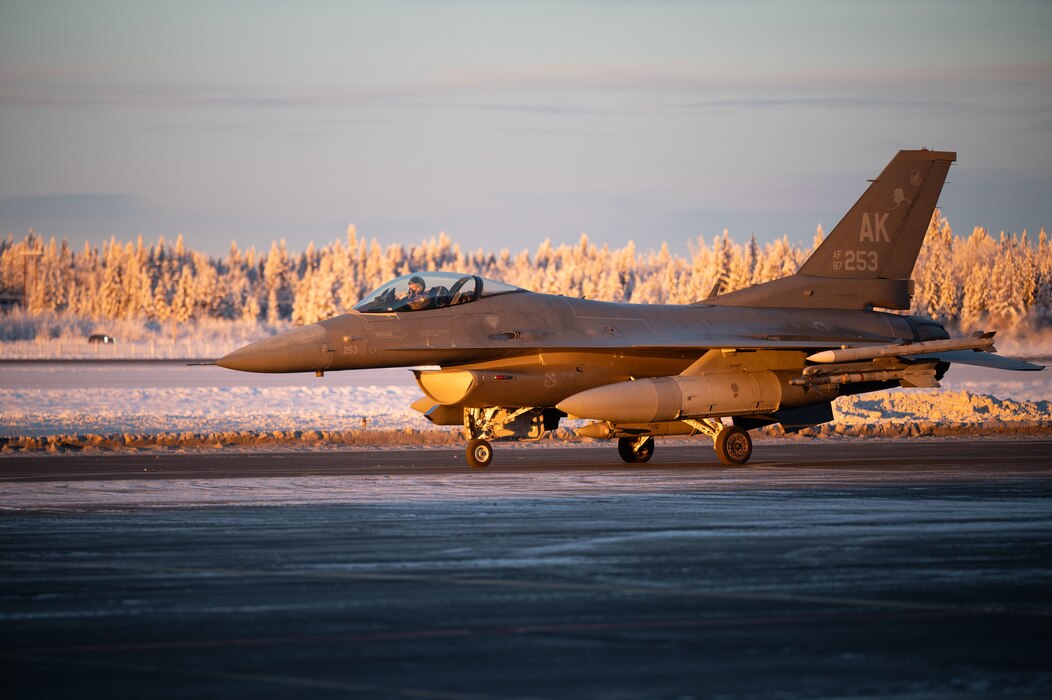 A U.S. Air Force F-16 Fighting Falcon assigned to the 18th Fighter Interceptor Squadron taxis before taking off at Eielson Air Force Base, Alaska, Nov. 18, 2025.