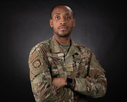 U.S. Air Force Senior Airman Craig Jeudy, Fifth Air Force technical support technician, poses for a photo.