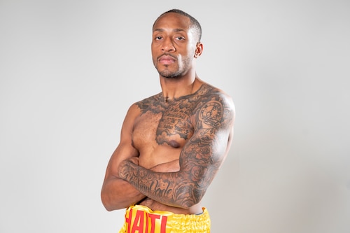 U.S. Air Force Senior Airman Craig Jeudy, Fifth Air Force technical support technician, poses for a photo before a boxing match.