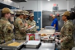 U.S. Airmen assigned to the 325th Operational Medical Readiness and Force Support Squadrons review food temperatures during a routine food safety inspection at the dining facility on Tyndall Air Force Base.