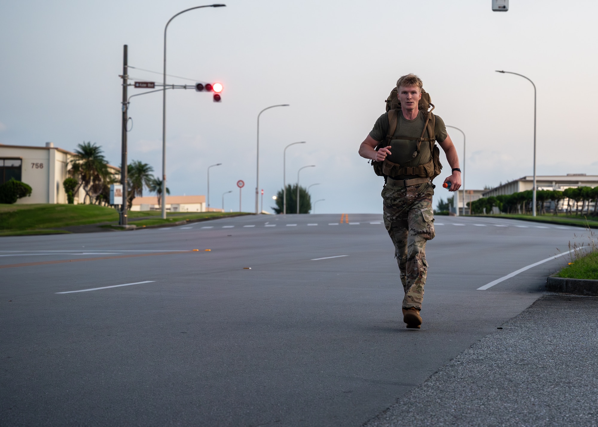U.S. Air Force SrA Damon Dane, 18th Emergency Medical Squadron paramedic, runs towards the finish line during the Norwegian Foot March on Kadena Air Base, Japan, Nov 22, 2025.