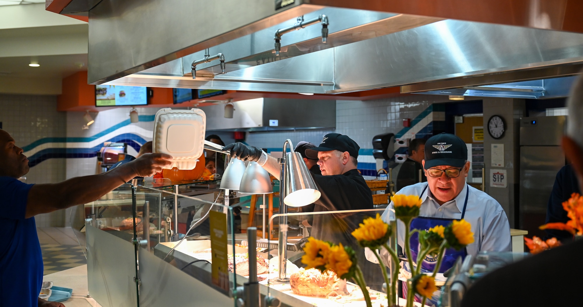 U.S. Congressman Salud Carbajal (D-24th/CA) serves a Thanksgiving meal to Vandenberg Space Force Base personnel at Breakers Dining Facility.