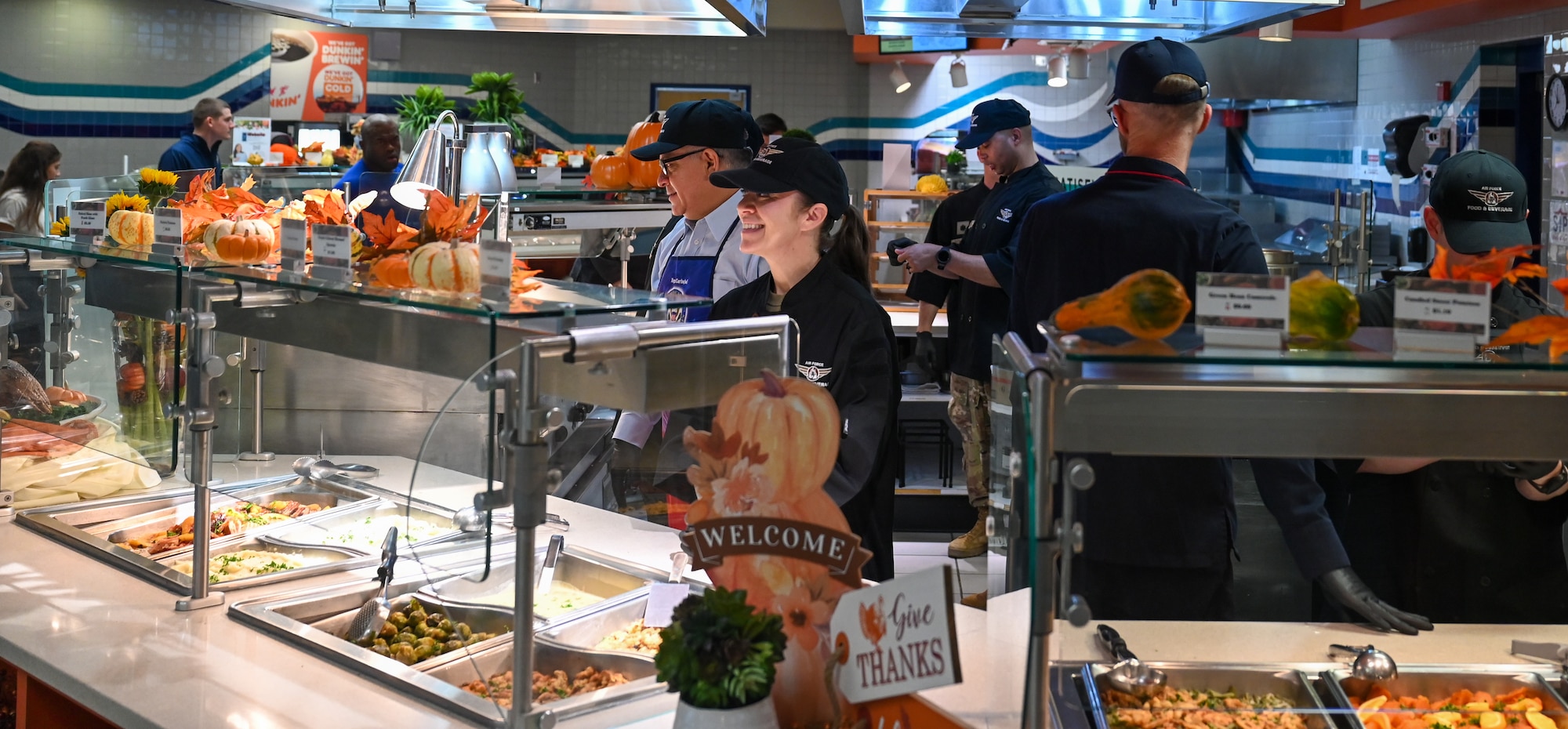 U.S. Space Force Chief Master Sgt. Shannan Sanchez, Space Launch Delta 30 senior enlisted leader, serves a Thanksgiving meal to Vandenberg Space Force Base service members.