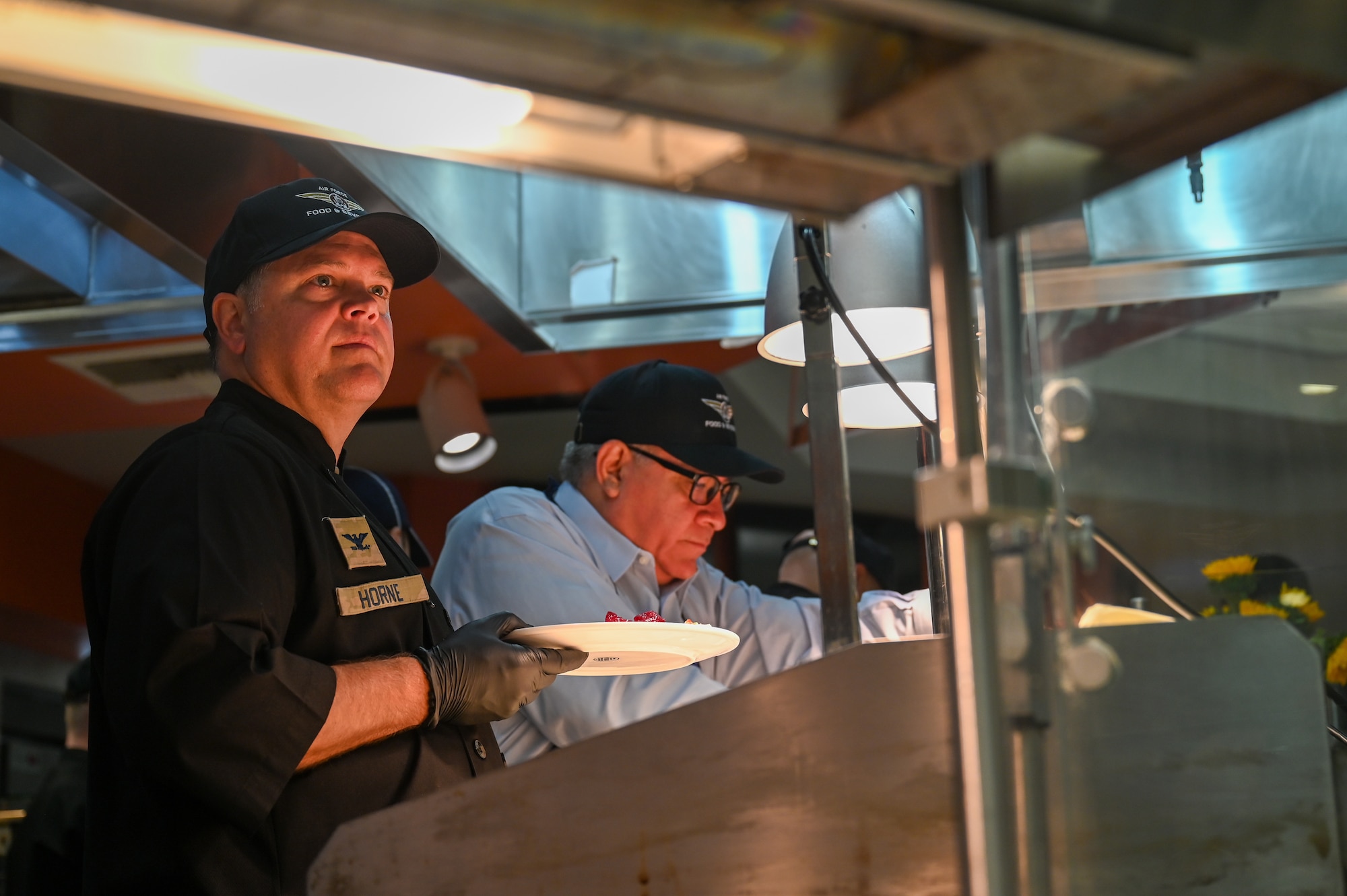 U.S. Space Force Col. James T. Horne III, Space Launch Delta 30 commander, serves a Thanksgiving meal to Vandenberg Space Force Base service members.
