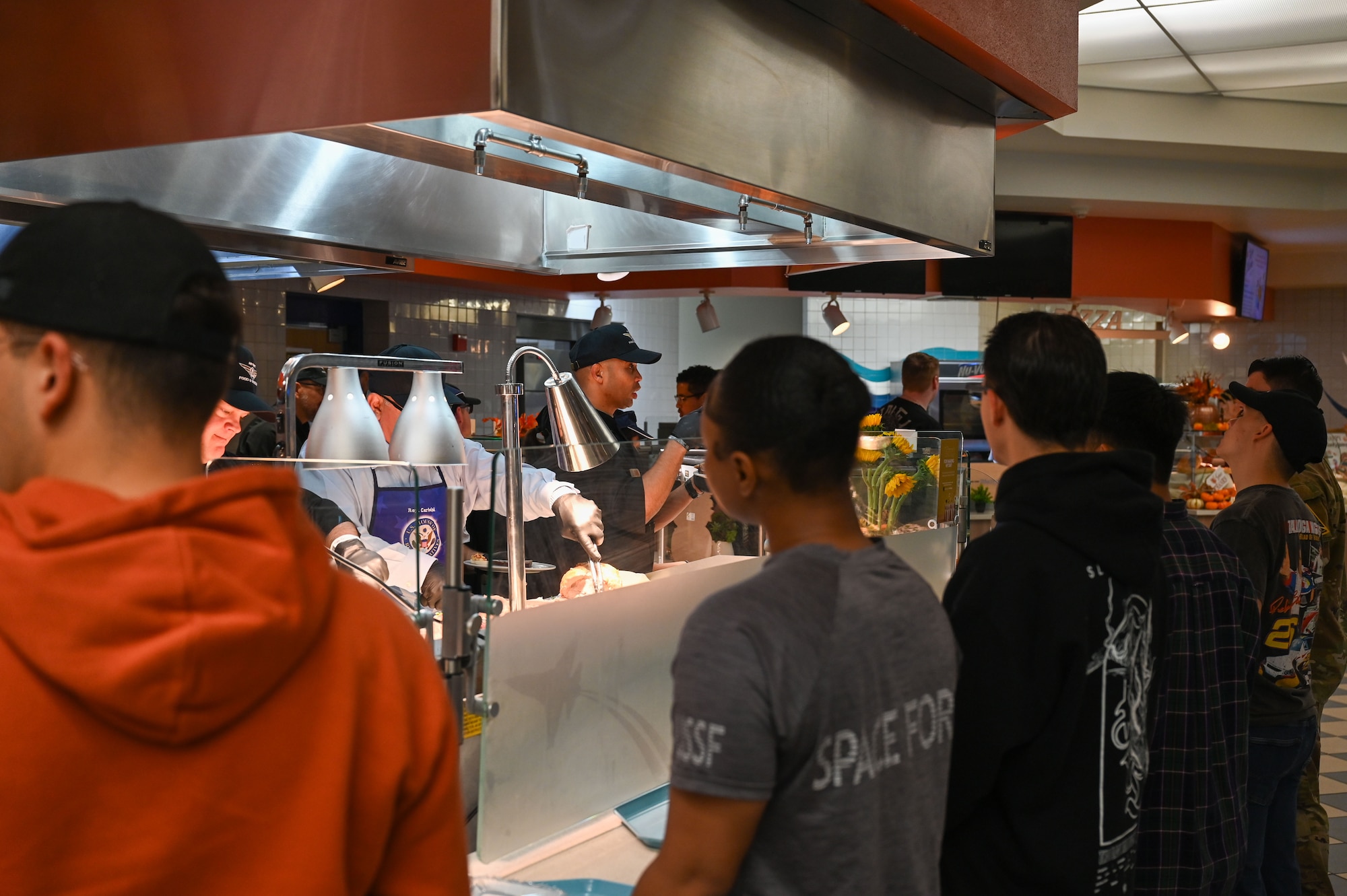 U.S. Air Force Chief Master Sgt. Malcolm Summer II, Space Launch Delta 30 senior enlisted airman, serves a Thanksgiving meal to Vandenberg Space Force Base service members.