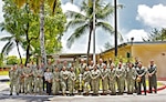 DIEGO GARCIA, British Indian Ocean Territory (Oct. 3, 2025) — Sailors and civilian staff assigned to U.S. Naval Hospital (USNH) Yokosuka’s Branch Health Clinic (BHC) Diego Garcia pose for a group photo. (U.S. Navy photo by USNMRTU Diego Garcia)