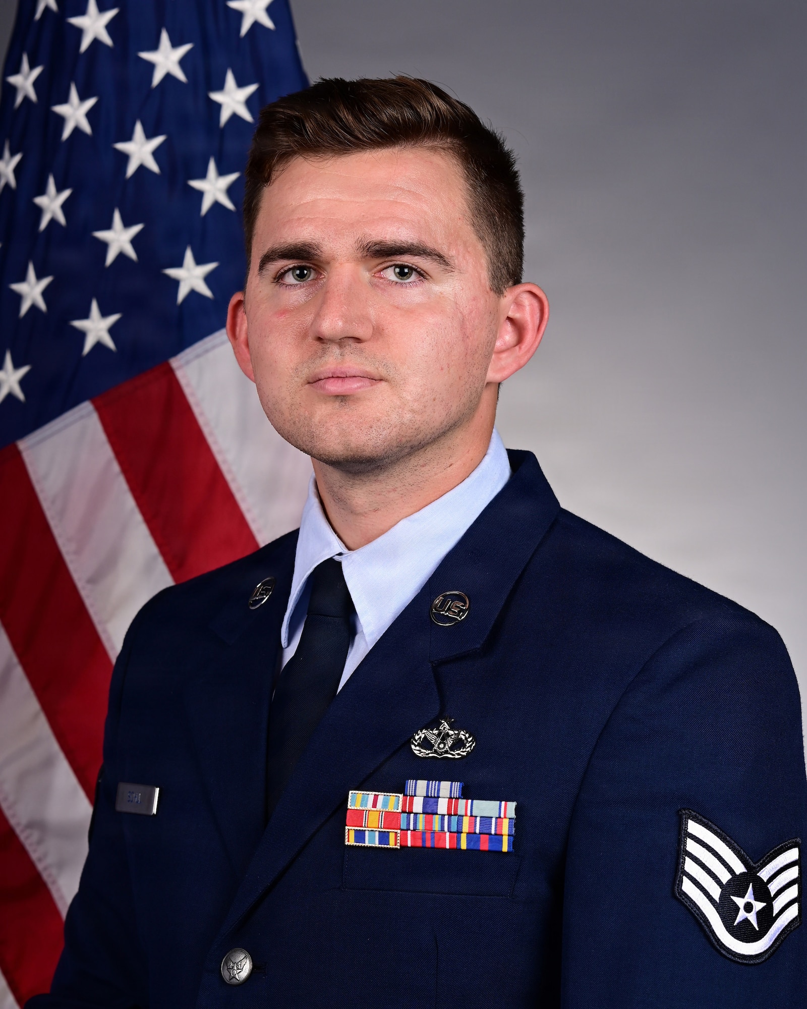 U.S. Air Force Staff Sgt. Joshua Schul, 355th Civil Engineer Squadron unit deployment manager, poses for an official photo at Davis-Monthan Air Force Base, Arizona, Sept. 26, 2025. Schul was selected for the Senior Leader Enlisted Commissioning Program - Officer Training School, SLECP-O,  a competitive program where only two Airman per major command are chosen by the MAJCOM commander to earn a commission. (U.S. Air Force photo by Senior Airman Jasmyne Bridgers-Matos)
