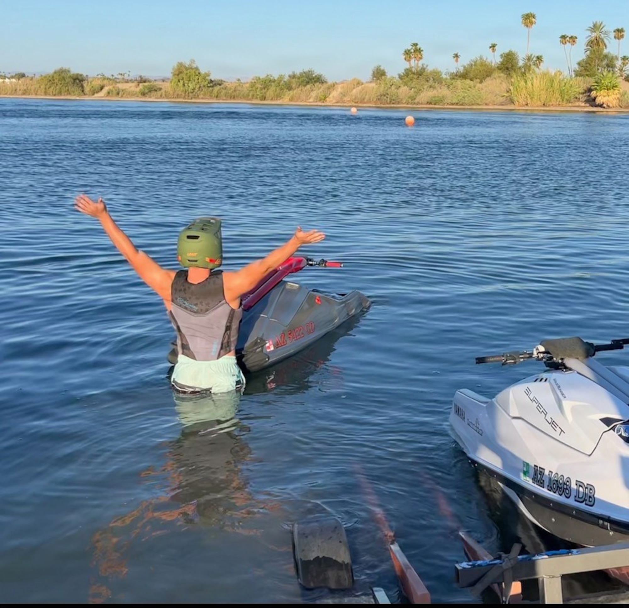 U.S. Air Force Staff Sgt. Joshua Schul, 355th Civil Engineer Squadron unit deployment manager, celebrates after riding a jetski at Lake Havasu City, Arizona. (Courtesy Photo)