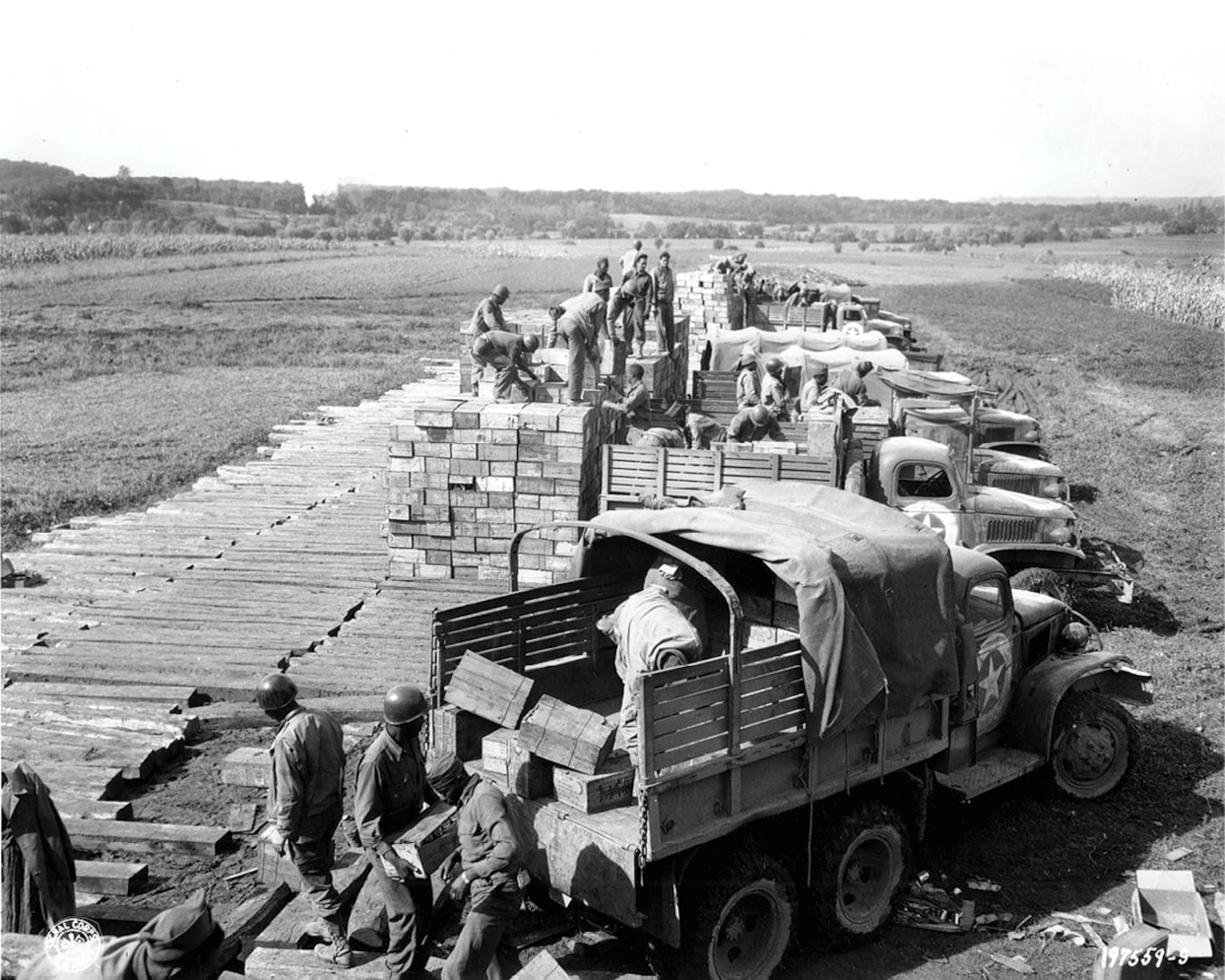 Soldiers with the Red Ball Express load trucks with combat rations in preparation for a convoy to the front line Dec. 21, 1944, in the European theater of operations.
