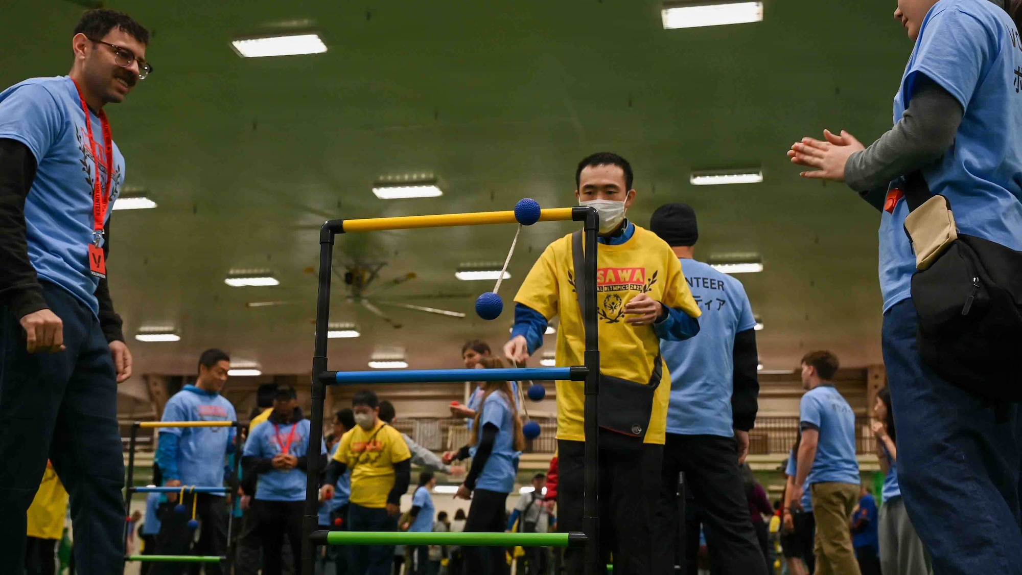 A participant tests his skill on Ladder Ball during the Misawa Special Olympics 2025 event at Misawa Air Base, Japan, Nov. 15, 2025. The Special Olympics brings both on and off base communities together to celebrate both friendly competition and the U.S.-Japan bond.  (U.S. Air Force photo by Airman 1st Class Adryan Young)