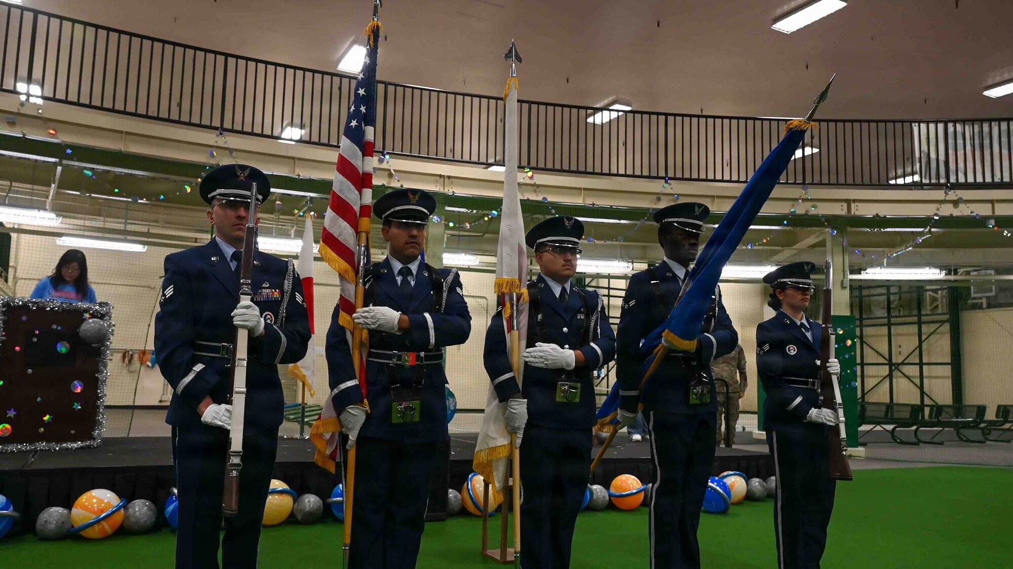 U.S. Air Force honor guard members assigned to the 35th Fighter Wing present colors during the Misawa Special Olympics 2025 opening ceremony at Misawa Air Base, Japan, Nov. 15, 2025. The honor guard supports community events with professionalism, carrying joint flags to represent the close bond with the host nation of Japan. (U.S. Air Force photo by Airman 1st Class Adryan Young)