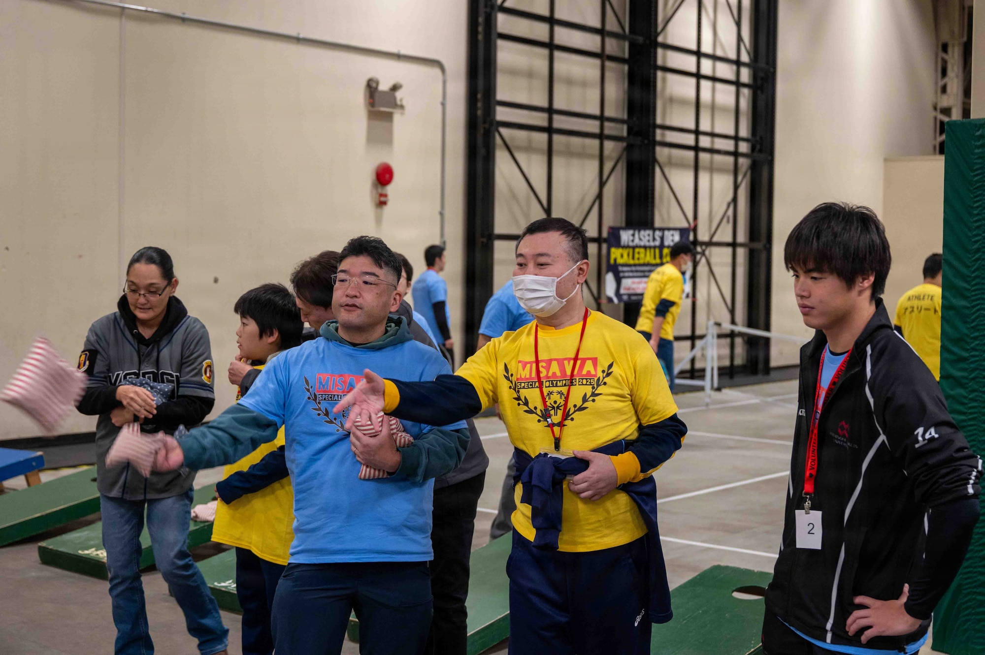 A participant plays cornhole during the Misawa Special Olympics 2025 event at Misawa Air Base, Japan, Nov. 15, 2025. The annual Special Olympics brings the community together to celebrate both friendly competition and the U.S.-Japan bond. (U.S. Air Force photo by Airman 1st Class Adryan Young)