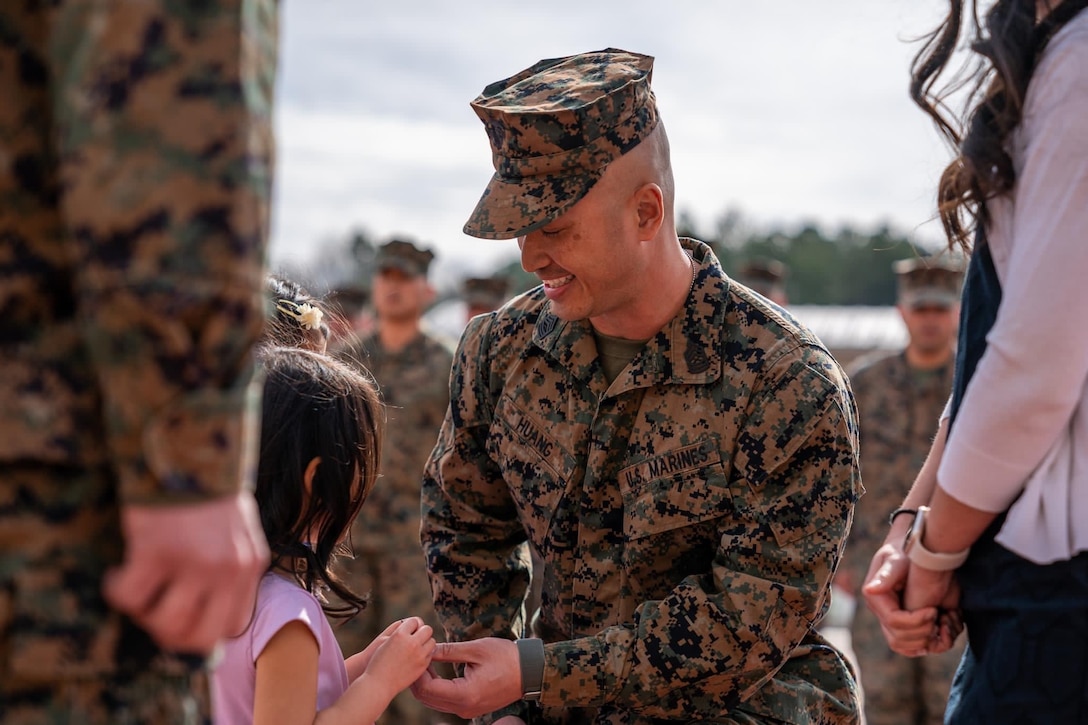U.S. Marine Corps Master Sgt. Kuan C. Huang, a communications chief with United States Marine Corps Forces Korea, hands his daughter rank insignia to pin on to his collar during his promotion ceremony to Master Sergeant in Quantico, Virginia, May 1, 2023. Huang was recently recognized by the Camp Humphreys Army Education Center during the Joint College Recognition Ceremony for his recent college graduation alongside other service members and civilians. MARFORK is the U.S. Marine Corps' service component for United States Forces Korea and United Nations Command. (Courtesy photo).