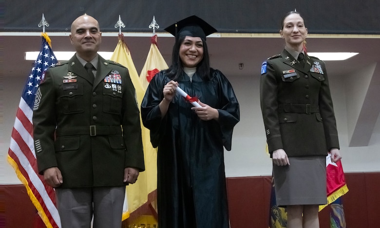 U.S. Marine Corps Sgt. Stephanie Enrriquez, an administration specialist with U.S. Marine Corps Forces Korea and a native of Texas, poses for a photo during a graduation ceremony on U.S. Army Garrison Humphreys, South Korea, Sept. 26, 2025. The Camp Humphreys Army Education Center hosted the Joint College Recognition Ceremony to congratulate service members and civilians on their completion of college programs. MARFORK is the U.S. Marine Corps' service component for United States Forces Korea and United Nations Command. (U.S. Marine Corps Photo by Cpl. Simon Saravia)