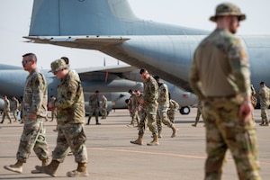 U.S. Airmen perform a foreign object debris walk