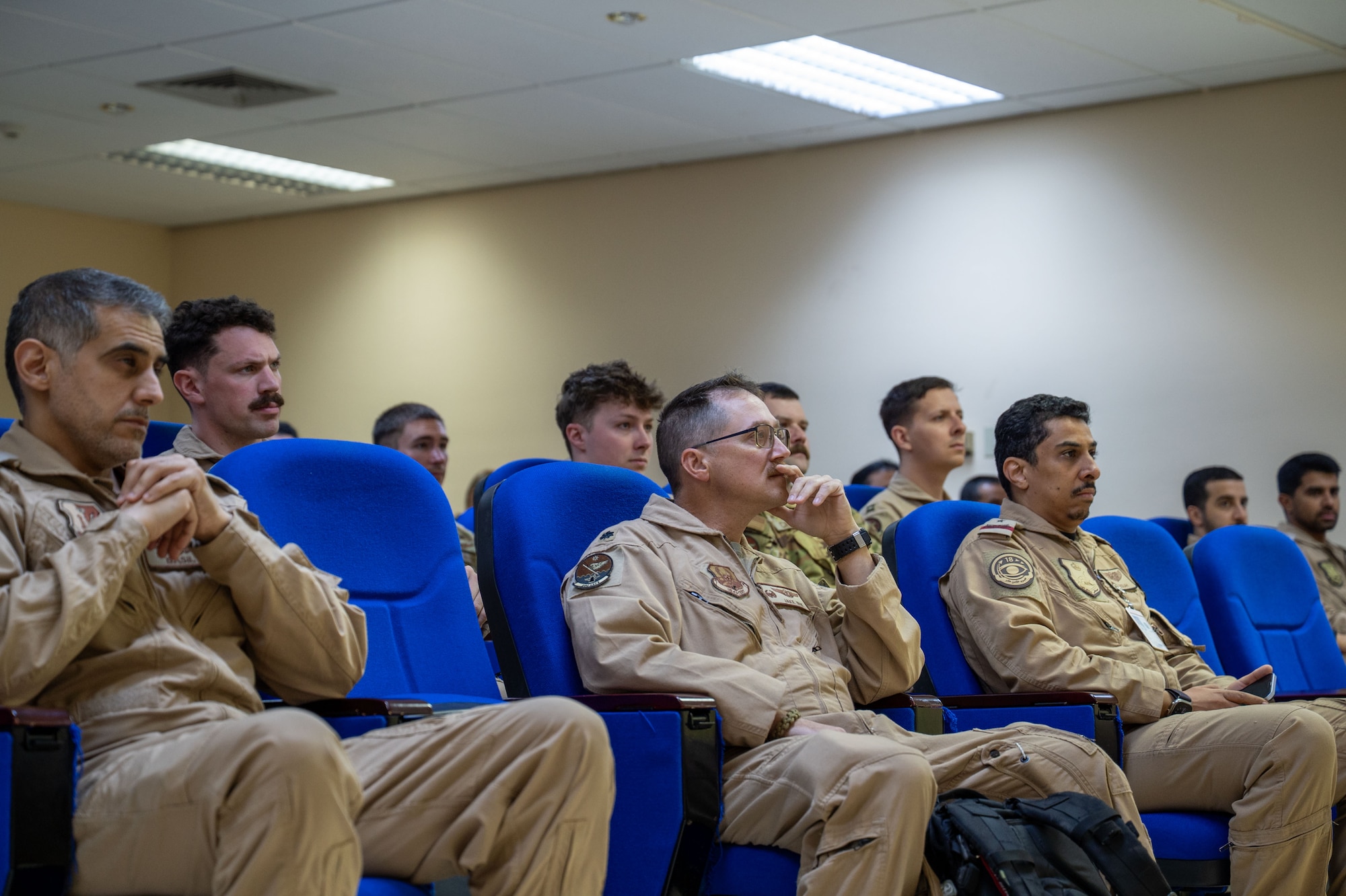 U.S. Air Force and Royal Saudi Air Force service members receive a brief before an integrated E-3 Sentry sortie.