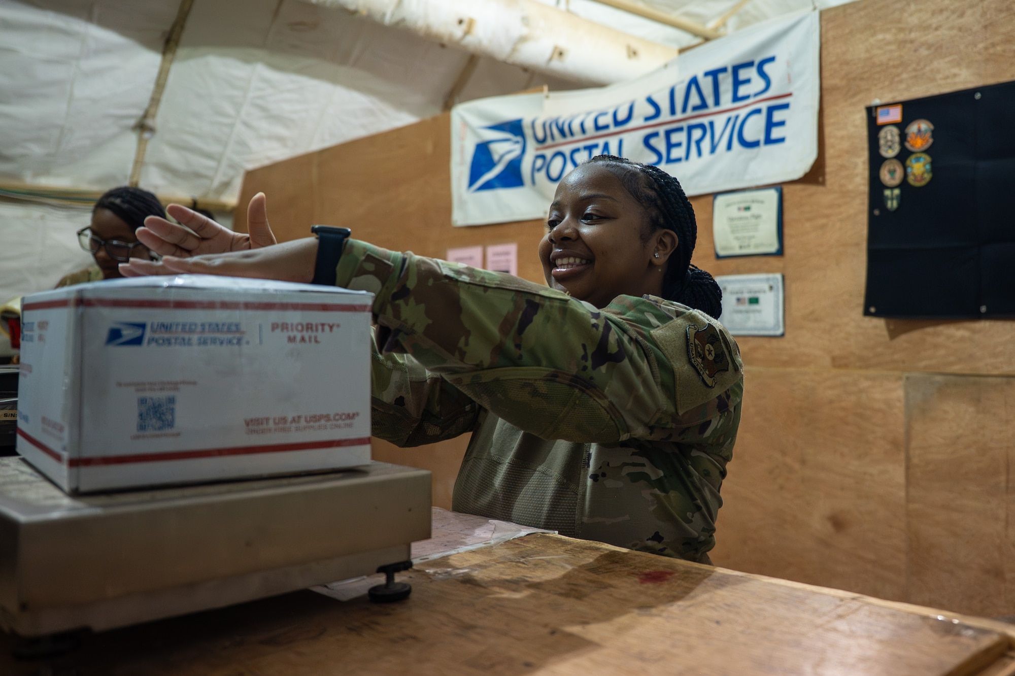 U.S. Airman attaches a shipping label to a package
