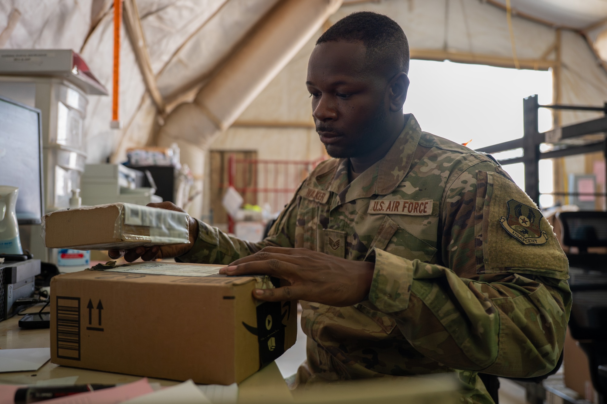 U.S. Airman verifies packing information