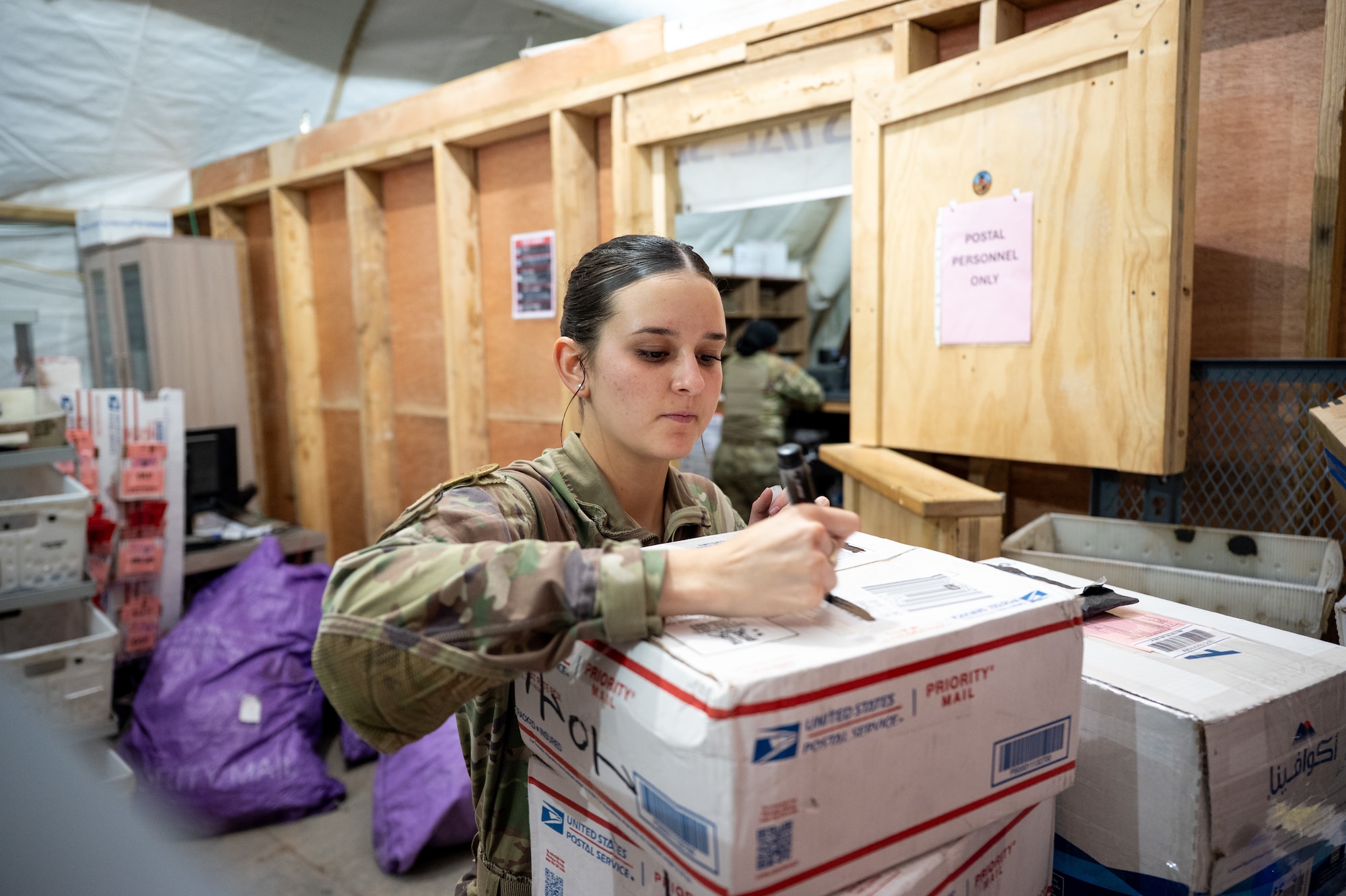 U.S. Airman verifies packing information