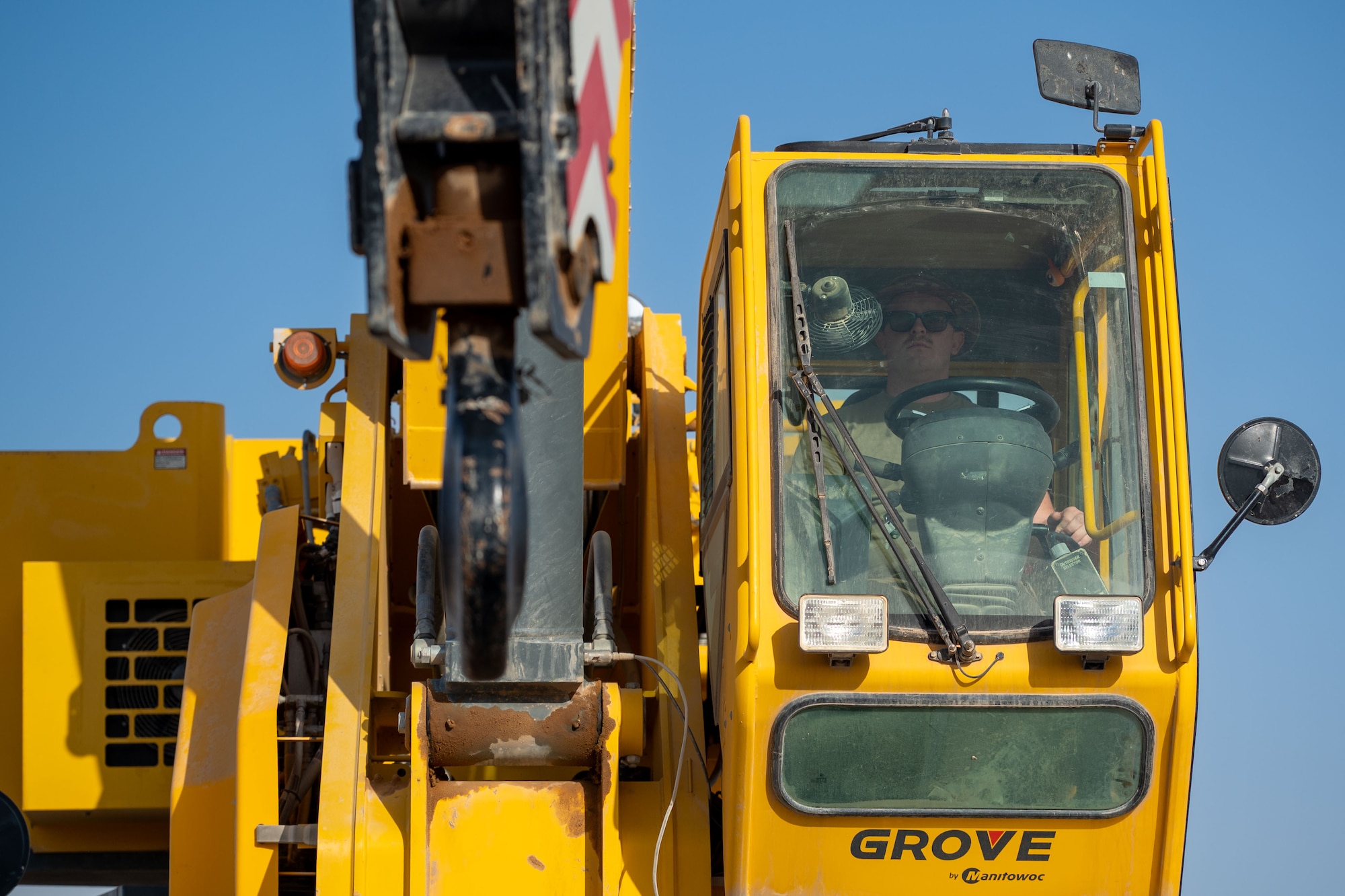 U.S. Air Force Staff Sgt. Robert McIntosh, 378th Expeditionary Civil Engineer Squadron pavements and equipment craftsman, operates a crane during a Crash, Damaged, Disabled, Aircraft Recovery exercise with Royal Saudi Air Force service members.
