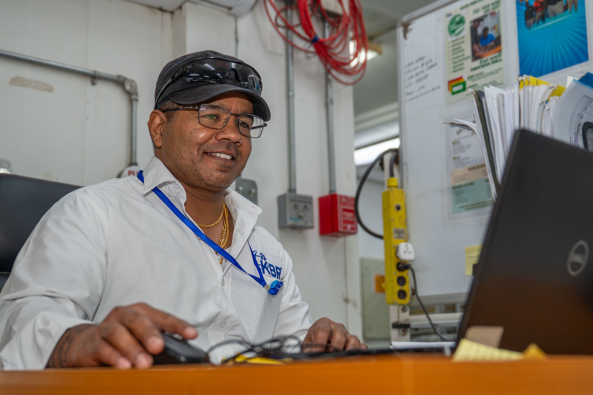 Pushpa Kumara, a Kellogg, Brown, and Root logistics support area dining facility supervisor, completes a checklist.