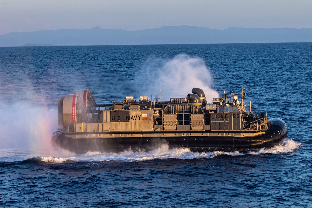 CARIBBEAN SEA - A U.S. Navy landing craft air cushion with the San Antonio-class amphibious transport dock ship USS San Antonio (LPD 17) transports Marines with 2nd Light Armored Reconnaissance, Battalion Landing Team 3/6, 22nd Marine Expeditionary Unit (Special Operations Capable), while underway in the Caribbean Sea, September 22, 2025. U.S. military forces are deployed to the Caribbean in support of the U.S. Southern Command mission, Department of War-directed operations, and the president's priorities. (U.S. Marine Corps photo by Sgt. Nathan Mitchell)