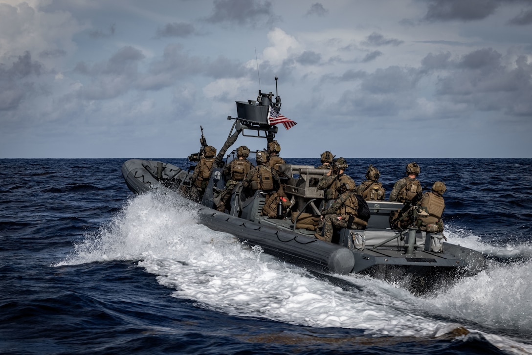 CARRIBEAN SEA - U.S. Marines with Maritime Special Purpose Force, and Weapons Company, Battalion Landing Team 3/6, 22nd Marine Expeditionary Unit (Special Operations Capable) conduct rigid-hull inflatable boat training operations while underway in the Caribbean Sea, September 19, 2025. U.S. military forces are deployed to the Caribbean in support of the U.S. Southern Command mission, Department of War-directed operations, and the president’s priorities. (U.S. Marine Corps photo by Sgt. Nathan Mitchell)
