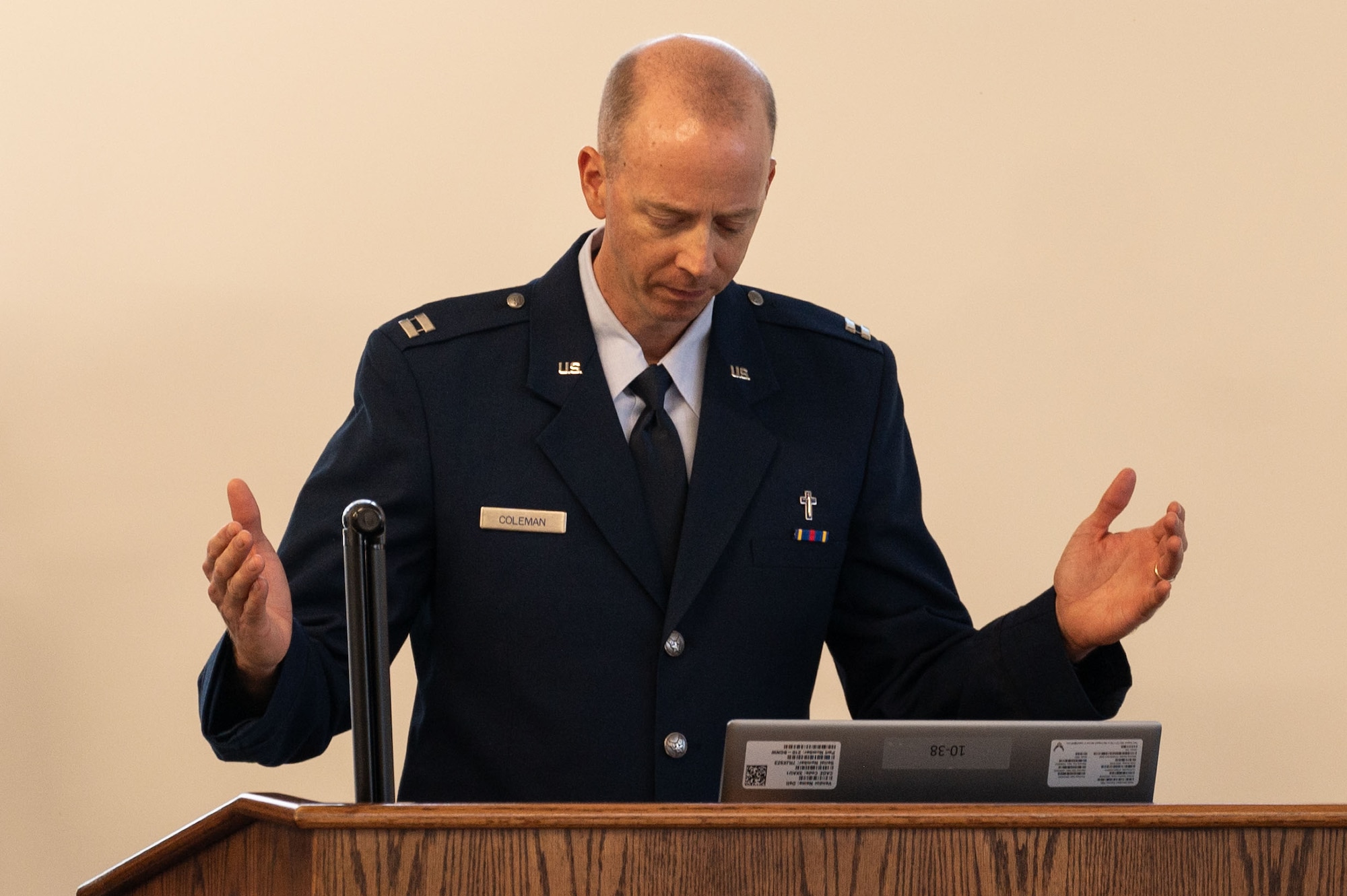 U.S. Air Force Capt. Jamie Coleman, 6th Air Refueling Wing chaplain, leads a moment of silence during the Gold Star Mother’s and Family Day event at MacDill Air Force Base, Florida, Sept. 28, 2025. The Gold Star is a historic symbol of recognition dating back to 1917. The event honored those who paid the ultimate price for the nation. (U.S. Air Force photo by Senior Airman Sterling Sutton)