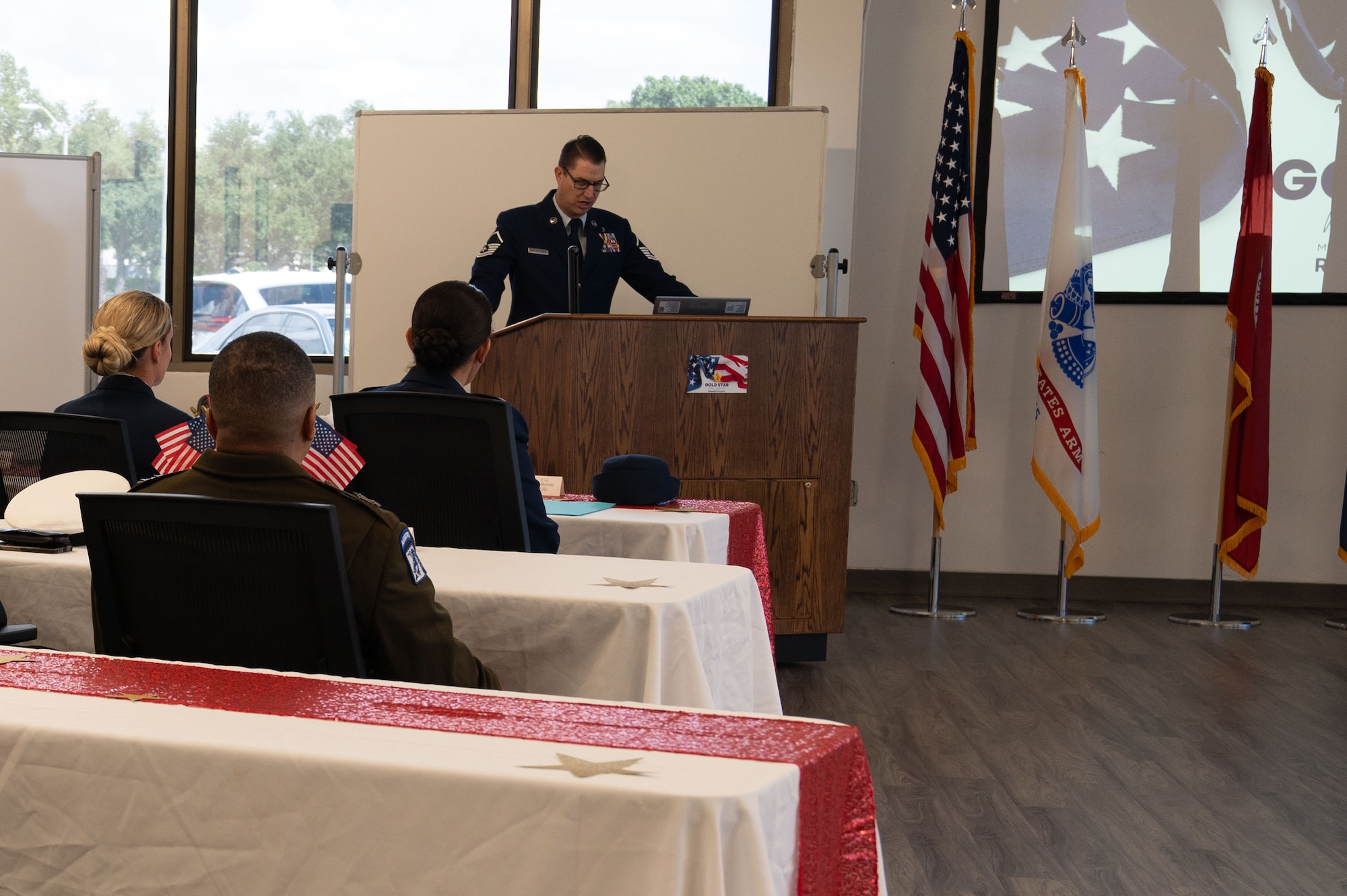 U.S. Air Force Master Sgt. Alexander Bartholomew, 6th Force Support Squadron military and family readiness center superintendent, narrates the Gold Star Mother’s and Family Day event at MacDill Air Force Base, Florida, Sept. 28, 2025. The Gold Star is a historic symbol of recognition dating back to 1917. The event honored those who paid the ultimate price for the nation. (U.S. Air Force photo by Senior Airman Sterling Sutton)