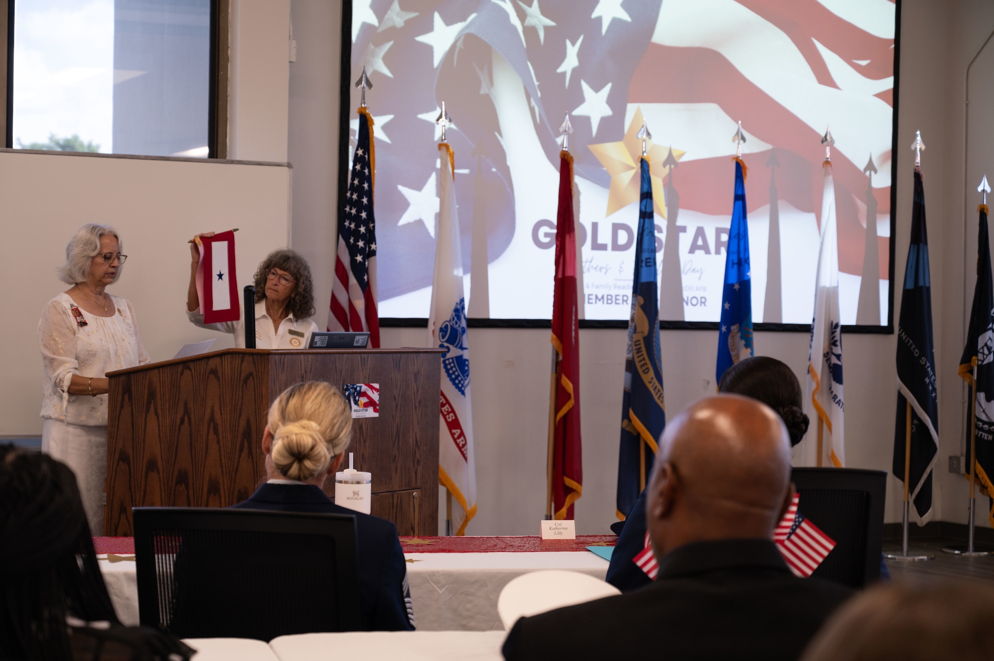 Michele Carey, Gold Star Mother of U.S. Marine Corps Corporal Barton Humlhanz, and Toni Gross, Gold Star Mother of U.S. Army Corporal Frank R. Gross, present the symbols of service and sacrifice during the Gold Star Mother’s and Family Day event at MacDill Air Force Base, Florida, Sept. 28, 2025. Since 1936, Gold Star Mother’s and Family Day has recognized the loved ones of those who have died in the line of duty. (U.S. Air Force photo by Senior Airman Sterling Sutton)