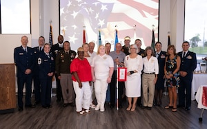 Service members and  Gold Star mothers and families gathered for a photo during the Gold Star Mother’s and Family Day event at MacDill Air Force Base, Florida, Sept. 28, 2025. Gold Star Mother’s Day is a nationally recognized observance that takes place on the last Sunday of September to honor mothers of fallen service members and their families. (U.S. Air Force photo by Senior Airman Sterling Sutton)