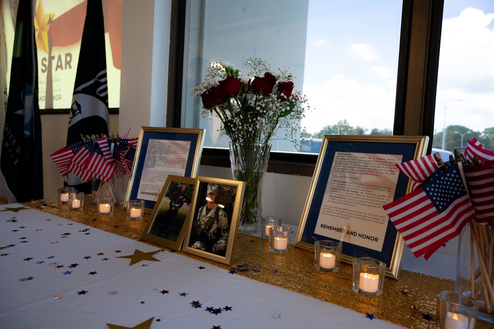 Pictures of fallen military members are displayed on a table during the Gold Star Mother’s and Family Day event at MacDill Air Force Base, Florida, Sept. 28, 2025. Since 1936, Gold Star Mother’s and Family Day has recognized the loved ones of those who have died in the line of duty. (U.S. Air Force photo by Senior Airman Sterling Sutton)