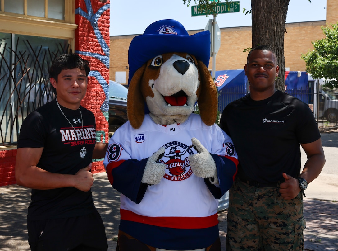 A U.S. Marine Corps Recruiter and poolee with Recruiting Sub-Station Amarillo, Recruiting Station Fort Worth, man a booth during the Texas Route 66 Festival on Route 66, Amarillo, Texas, June 14, 2025. The Texas Route 66 Festival was a 10-day event spanning across multiple cities along Route 66. The finale was hosted by the city of Amarillo and consisted of live music, car shows, and vendor booths. Marines utilized the enhanced-marketing Battle Position and the Marine pull-up bar challenge to engage with event attendees and talk to them about the Marine Corps as a career option. (U.S. Marine Corps Photo by Sgt. Kree Laing)