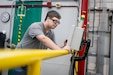 Jakob Stropas works on a human-machine interface that control the dip tanks located at Letterkenny Army Depot, on Sept. 10.