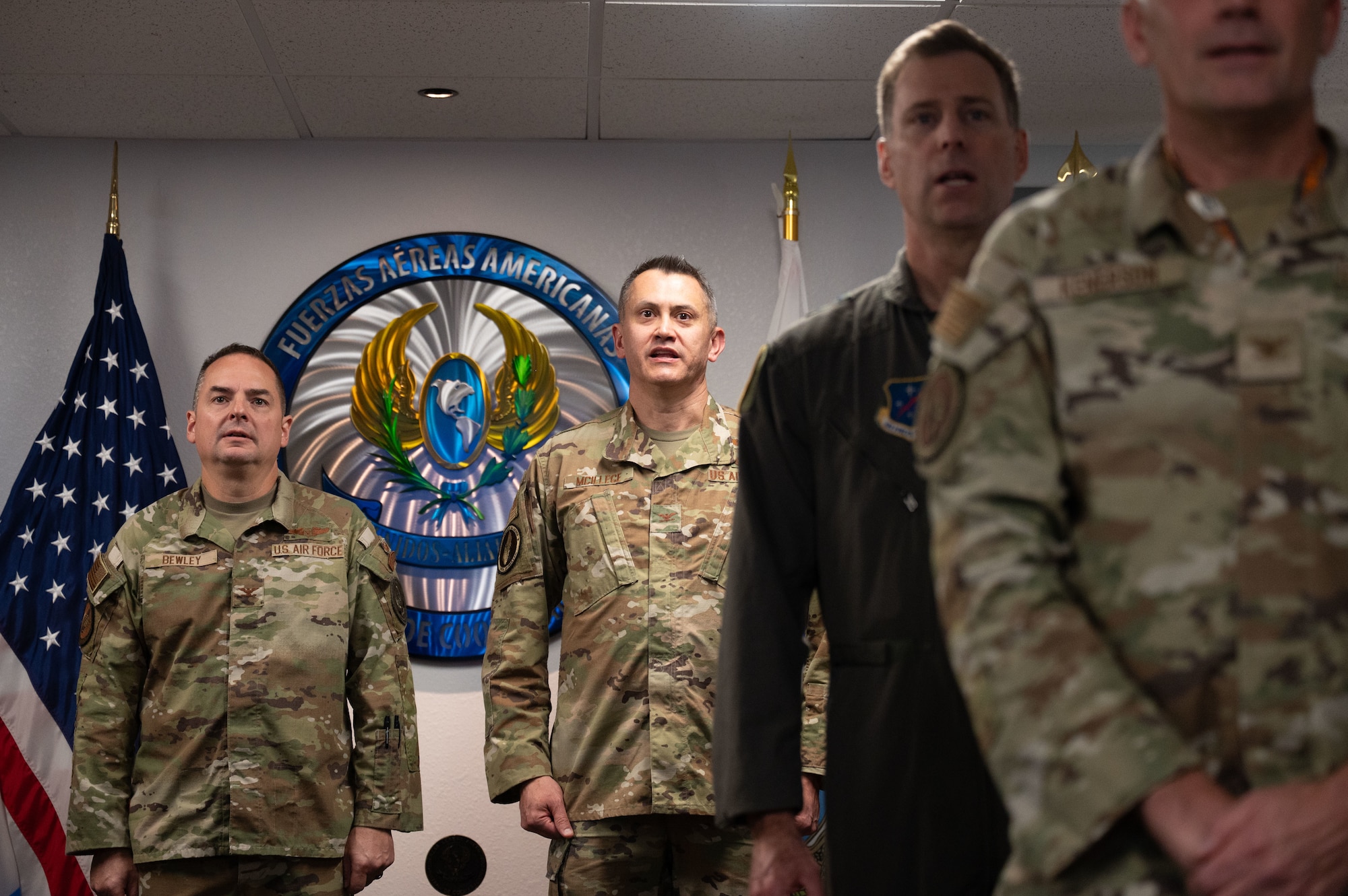 Members of the System of Cooperation Among the American Air Forces sing the SICOFAA song during a change of responsibility ceremony at Davis-Monthan Air Force Base, Arizona, Oct. 1, 2025. SICOFAA is composed of 23 member countries and two observer countries from across the Western Hemisphere. (U.S. Air Force photo by Airman Jaden Kidd)