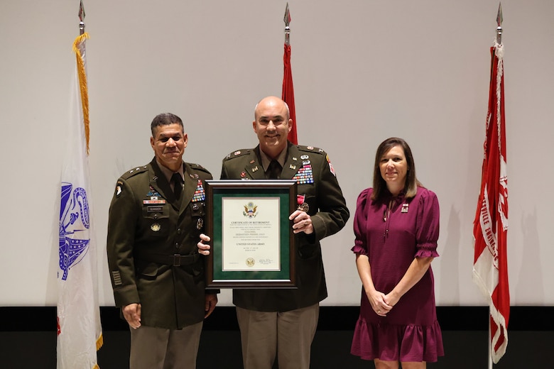 Departing Huntsville Center commander, Col. Sebastien Joly, accepts retirement certificate from Deputy Commanding General for Military and International Operations, Headquarters U.S. Army Corps of Engineers, Maj. Gen. Mark Quander, during Change of Command ceremony at the U.S. Space and Rocket Center’s Davidson Center for Space Exploration, 1 Tranquility Base, Huntsville, Alabama.