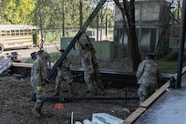 U.S. Soldiers and Airmen with the District of Columbia National Guard clean up building 12 at the Youth ChalleNGe Academy to help the facility expand and reach more youth in Laurel, Md., Oct. 1, 2025.  About 2,300 National Guard members are supporting the D.C. Safe and Beautiful mission providing critical support to the D.C. Metropolitan Police Department in ensuring the safety of all who live, work and visit the District.